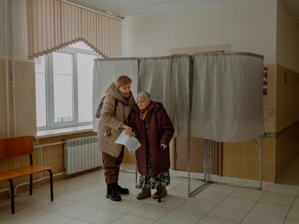 At the age of 94, Aliona’s grandmother votes for the president. She says: “God bless me, old fool, that I can vote for Putin one more time!” Tomsk, Russia, 16 March 2024