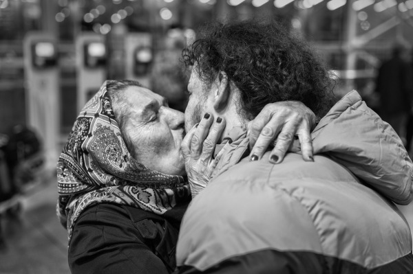 Mohammad (22) shares a farewell with his mother before embarking on a journey to Europe to seek better opportunities. Tehran, Iran, December 2023