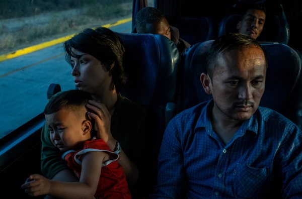 Ali, Taiba, and their son, from Afghanistan, are on a three-day bus trip, the last leg of their journey from Mexico City to Tijuana, where they will cross the border into the United States. Tepic, Mexico, 31 March 2023