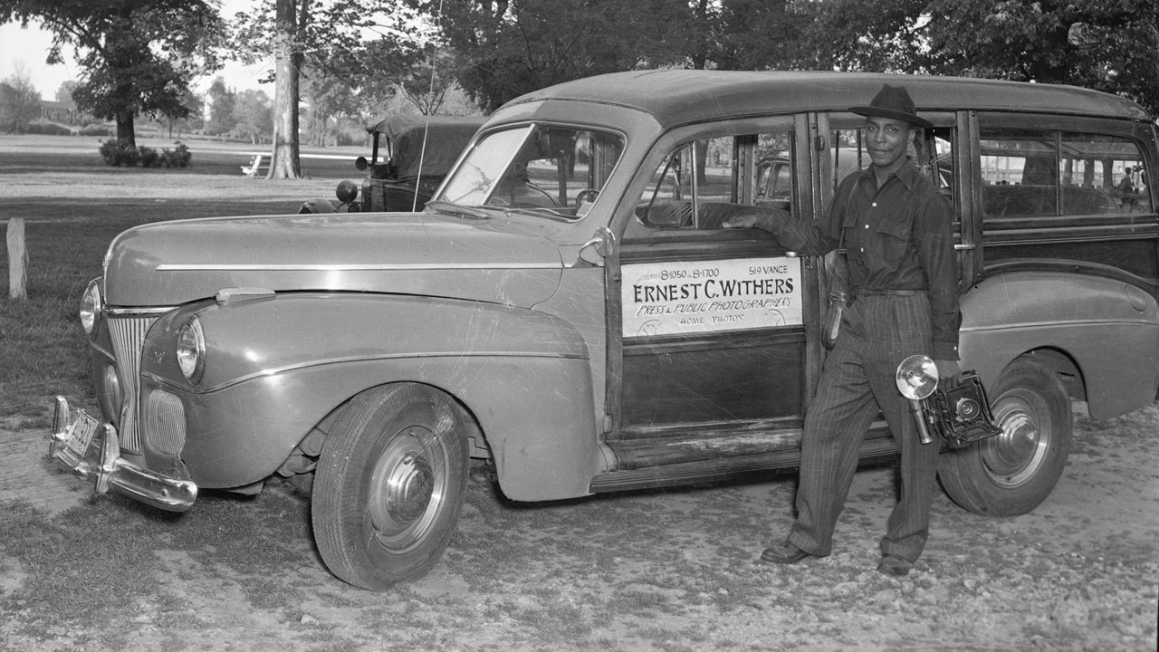 Ernest Withers historic still, with car and camera, from Double Exposure