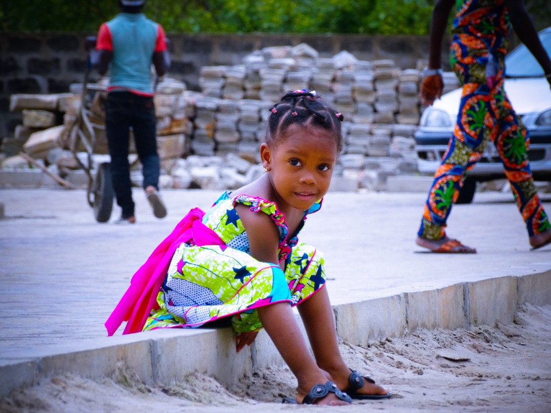 Photo by Femovier | child, girl, smile, vehicle, transportation, car
