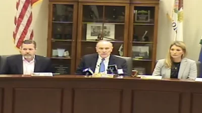 Village of Hinsdale President Thomas Cauley, Jr. (middle) called the special meeting to order. 