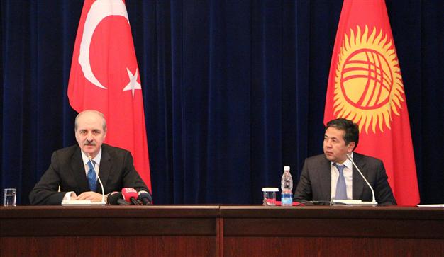 Turkey Deputy Prime Minister Numan Kurtulmus, left, and Kyrgyzstan President Almazbek Atambayev sign a memorandum of understanding during a recent economic conference.