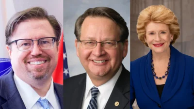 Jason Stverak, Chief Advocacy Officer, Defense Credit Union Council, left, U.S. Sen. Gary C. Peters (D-MI), center, U.S. Sen. Debbie Stabenow (D-MI)