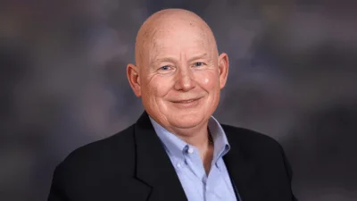 John R. Cooper,  Transportation Director 