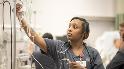 Medium nursing student working with iv top header main demsn page