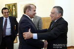 The Republic of Armenia Prime Minister Hovik Abrahamyan, left, receives Argentine-Armenian businessman Eduardo Eurnekian.