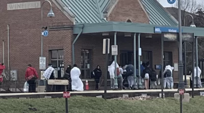 Illegal immigrants wandering on a Metra platform in Winfield.