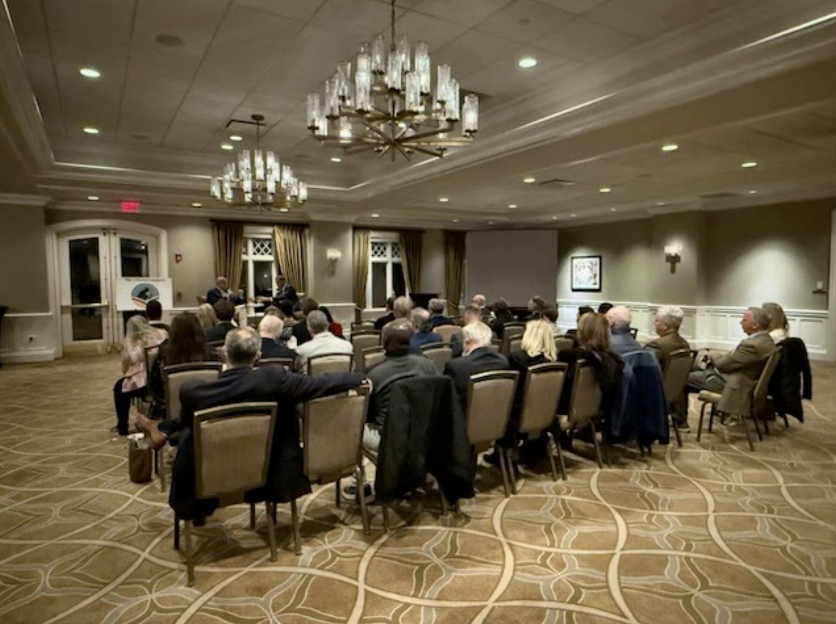 U.S. Sen. Eric Schmitt, R-Mo., right, speaks with Citizen Farmers co-founder Barrett Davie, left, at a private Oak Brook event on Nov. 20, discussing AI, national security, workforce, and government overreach. - Kristina McCloy