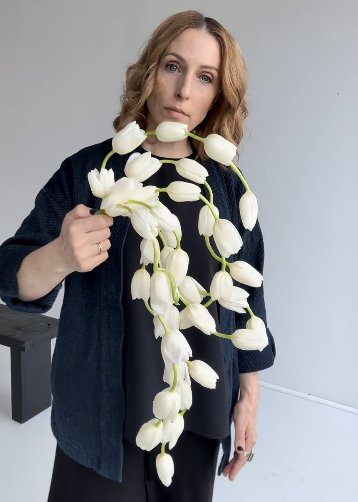 Sue holding a white tulip cascade