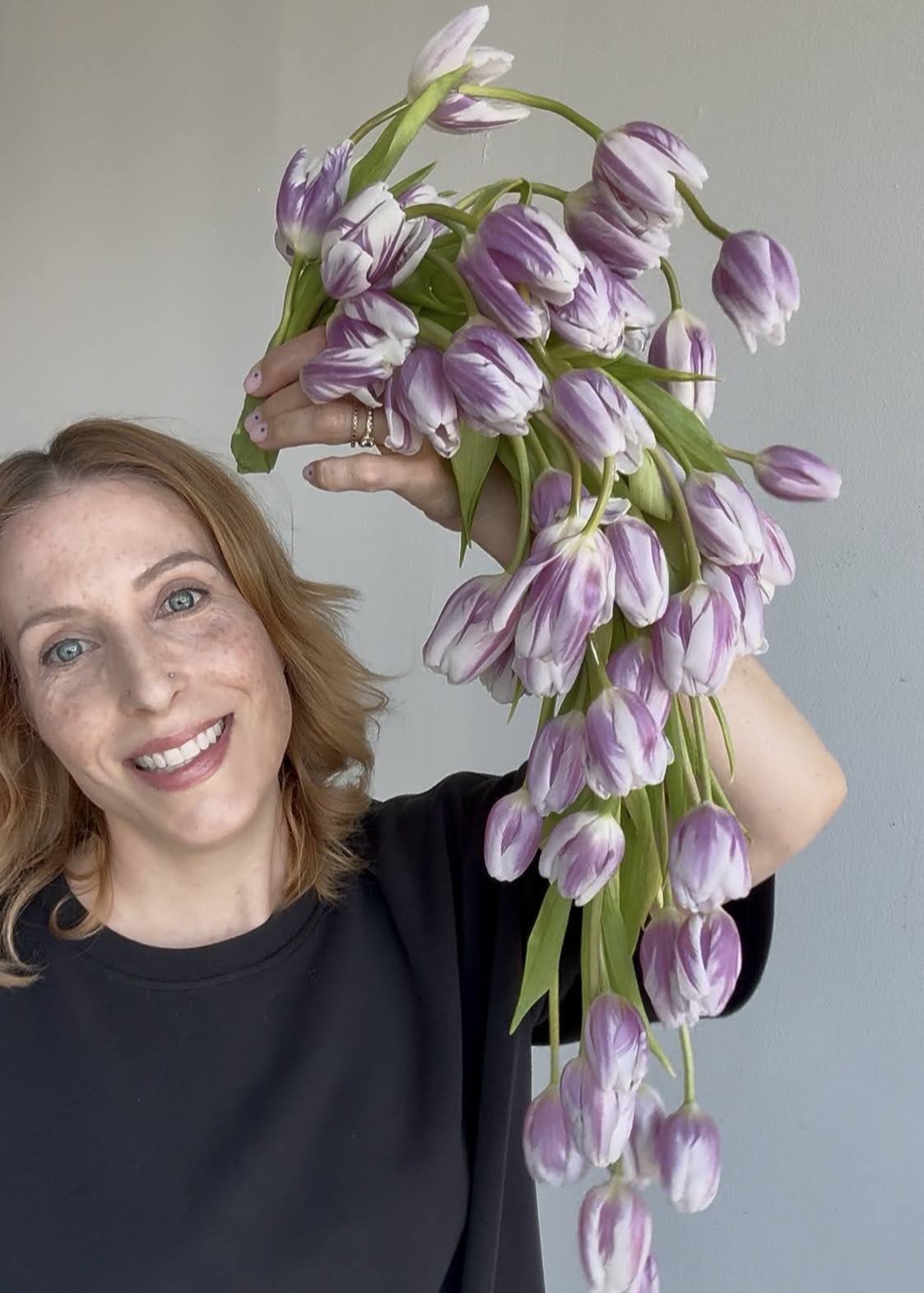 Sue holding a lavender tulip cascade
