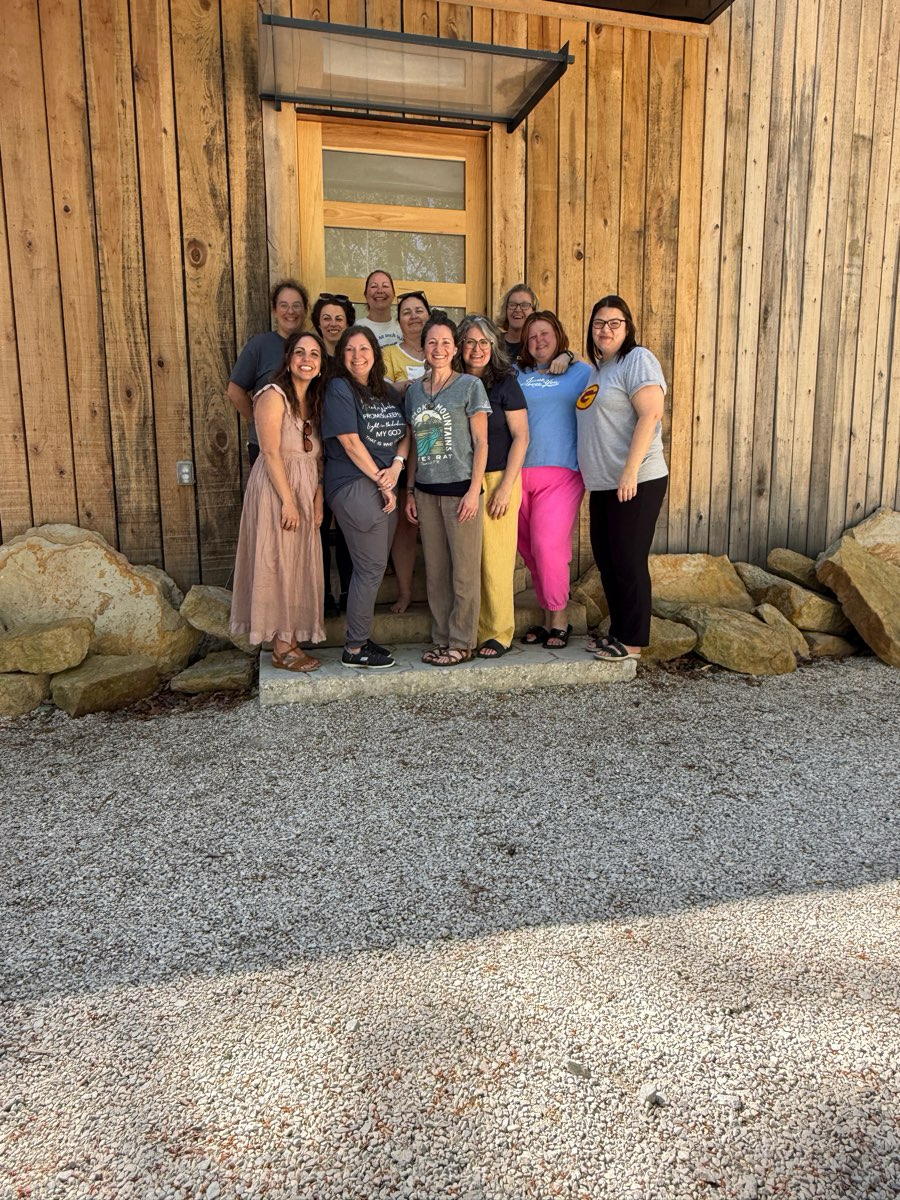 Women gathered in the woods at the Peace Retreat