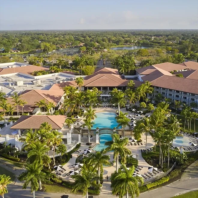 Aerial of a resort with a prominent pool