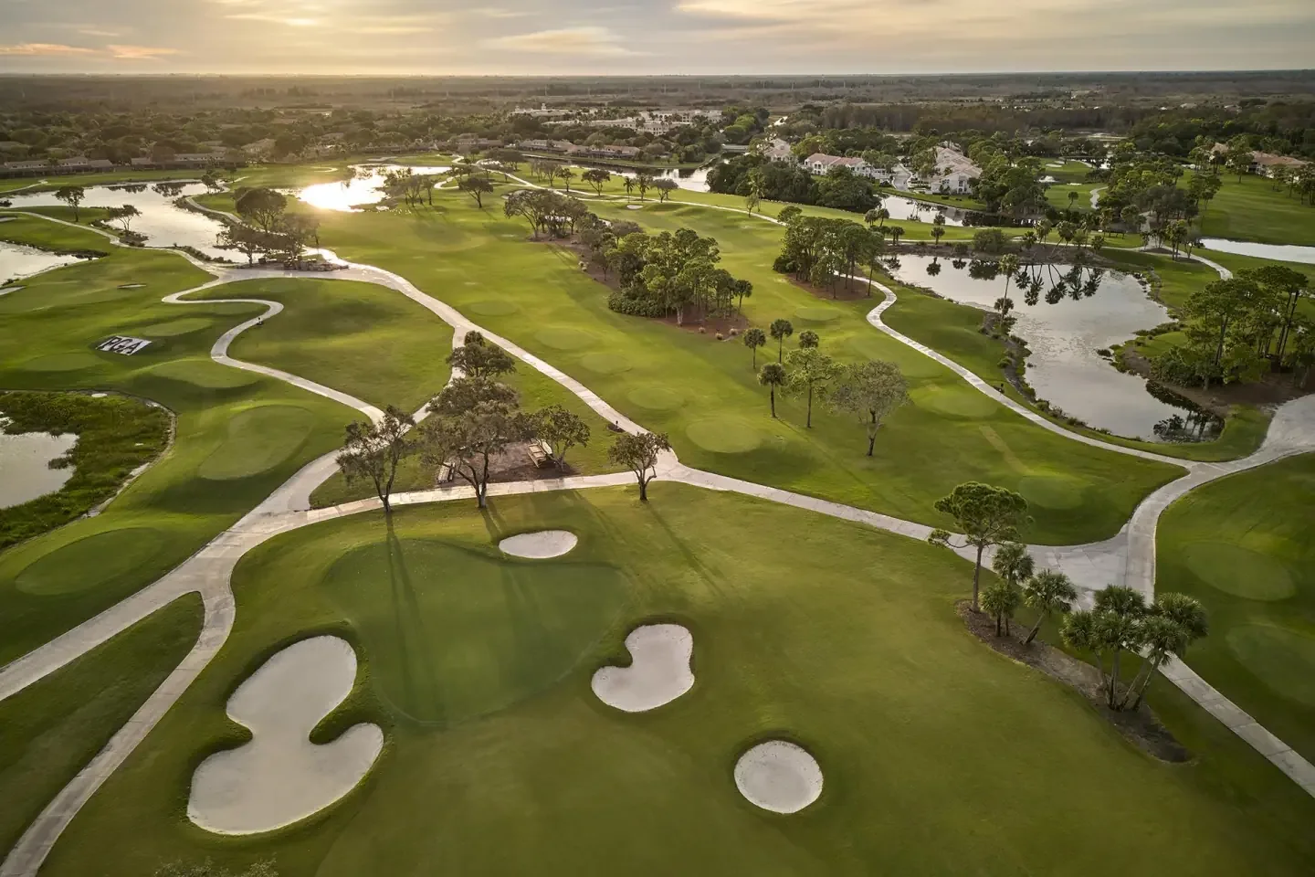 golf-course-sunset-aerial.webp