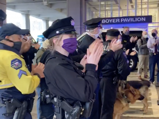 Temple police cheer workers at Temple University Hospital on Wednesday, April 22