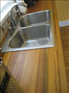 Sinker Cypress for kitchen countertop with tung oil finish.