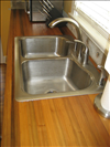 Sinker Cypress for kitchen countertop with tung oil finish.