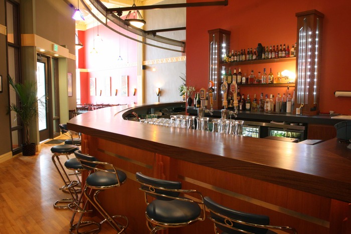 The sweeping Art Deco-styled bar is the centerpiece of The Kress as you enter. The Art Deco theme carries throughout the varied and unique restaurant and lounge areas.