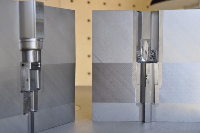 Hard tool steel mold for the light weight heatsink and light head. This tooling alone cost more than many new cars.