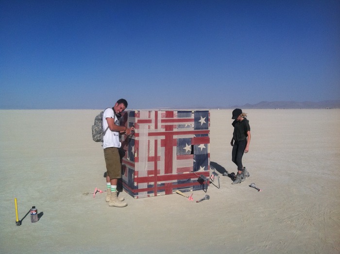 My brother, Brandon and his girlfriend, Caitlin, with "American Cube" on the playa.