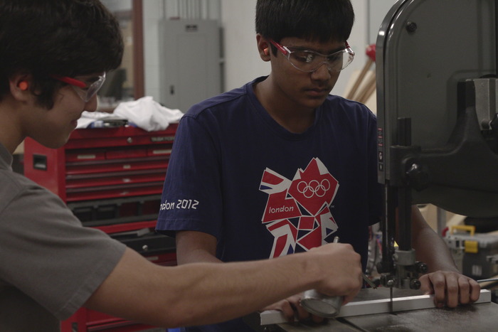 Making our prototype at a high school metal and wood shop.