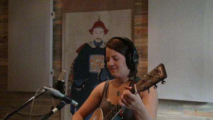 Monica laying it down in the studio...under the watchful eye of our guru.