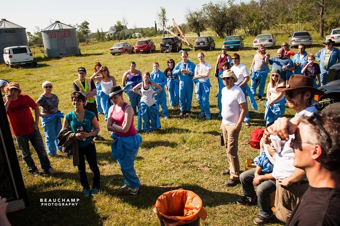 The cast and crew gathers around to for the first shot of the day.