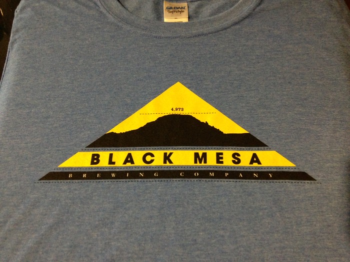 Logo T-shirt front.  Shirt is made of 65/35 poly/cotton blend for a soft feel and athletic fit.  If the athletic fit is too fitted for your taste, you may want to order a size larger than normal. Currently available in heather blue and red.