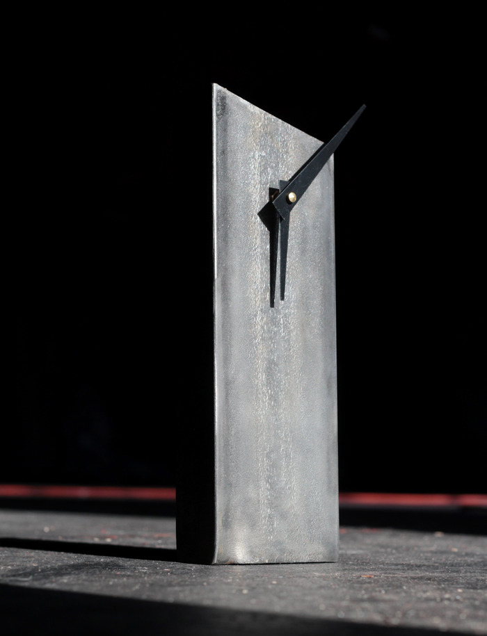 "Nine Degrees" - Just less than 6lbs - 12" tall.  Slight backwards tilt to improve stability.