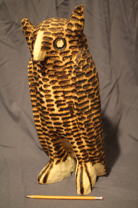 Giant hand carved pyrography wood statue.