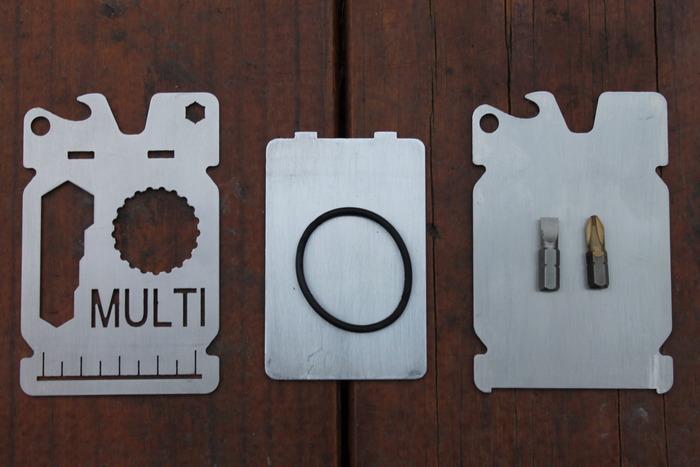 Front Plate, Aluminum Inside Card, Back Plate, (12) O-Rings, Phillips/Flat Head Screwdriver Bits