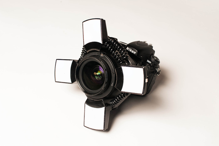 Use the Looky Loo Light as a stand for you lens.