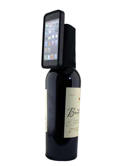 A wine bottle makes a great viewing stand with the Tech Wallet.