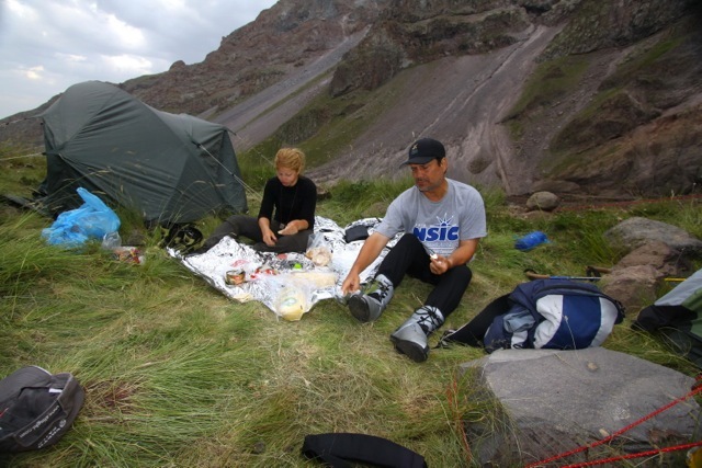Eating at base camp after a 12-hour day of climbing