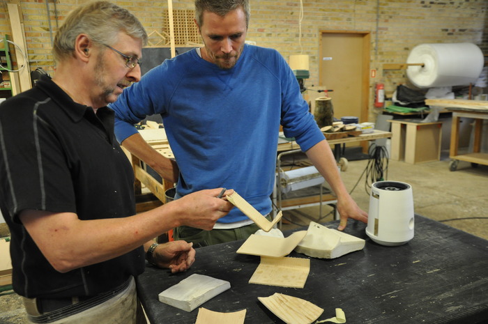 Lars discussing the molded wood wing details with the cabinetmaker