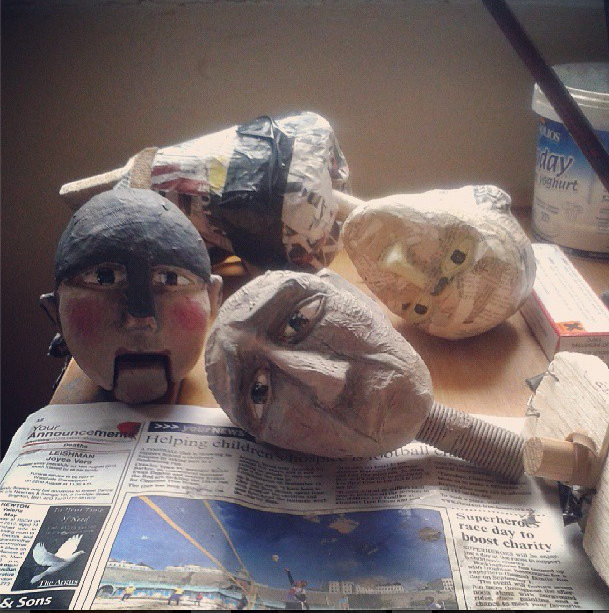Puppet heads being painted