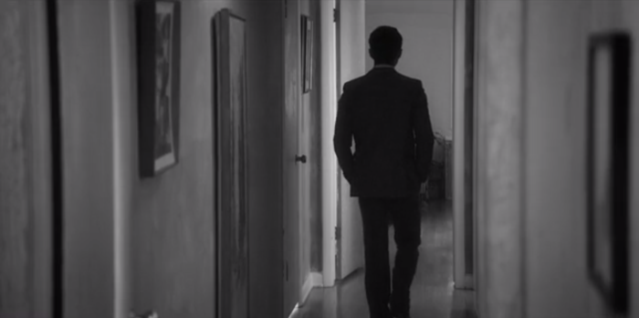 Actor Gopal Divan walks down a lonesome hallway.