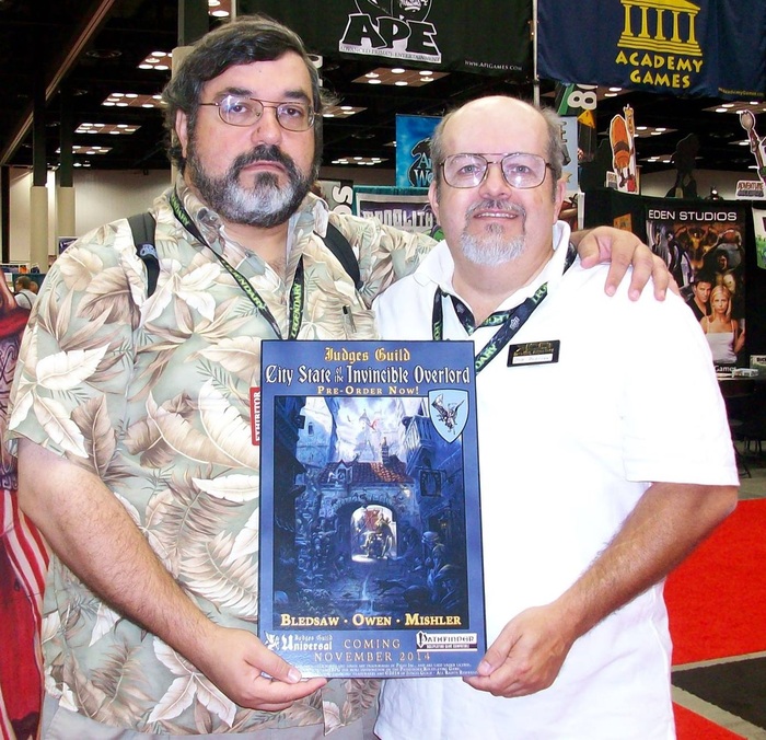 James Mishler and Bob Bledsaw II holding the CSIO Pre-order Poster