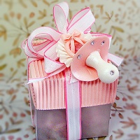Pink square box pacifier on top