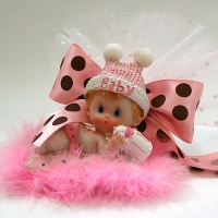 laying baby with ribbons many colors
