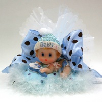 Laying baby with  blue ribbons