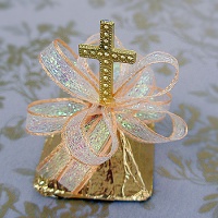 Gold wrapped chocolate with cross standing