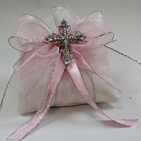 Pillow with pearl  cross on top