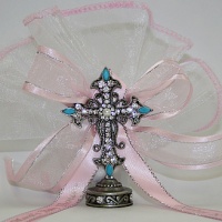 Turquoise cross with  pink ribbons