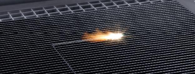 Cutting a hardened CFRP part: for materials less than four millimeters thick, the laser works two to three times faster than a water jet or milling tool and produces a higher-quality cut.