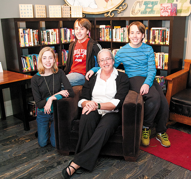 Betsy and her kids, where they most like to spend their time: the Library area. Photo by Brett Dorrian