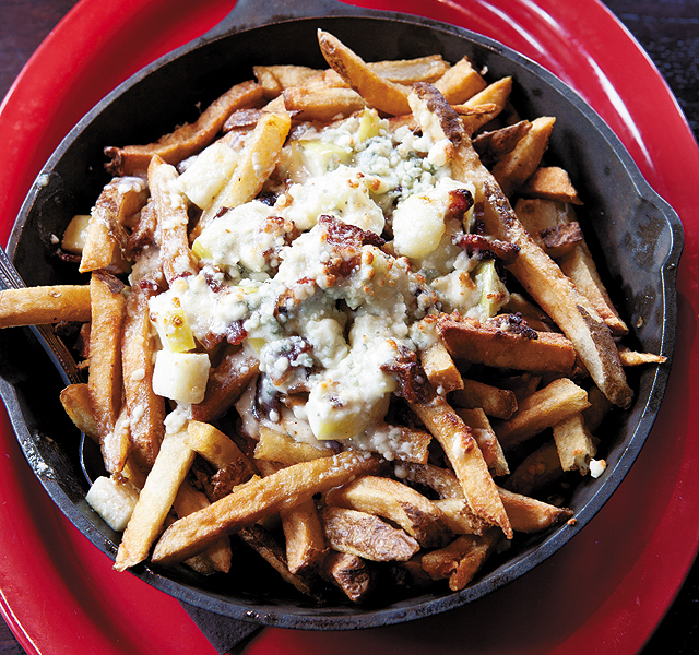Poutine made with fries, blue cheese, apples, and bacon; perfect combination. Photo by Hubert Bonnet
