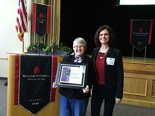 Lynn Mickelson, being presented with the 2015 Equity and Justice Award from the Minnesota Lavender Bar Association. The award was presented by one of her many former interns, Erin Keyes, now serving as the Assistant Dean of Students, University of Minnesota Law School. Photo courtesy of Lynn Mickelson