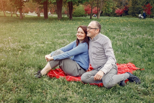 Couple sitting on blanket