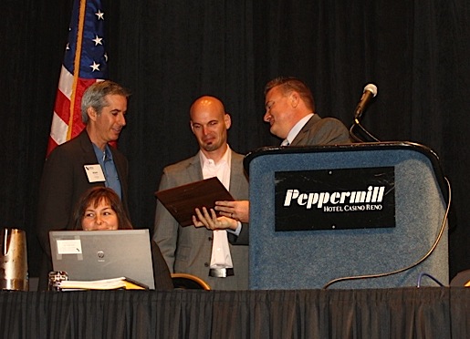 From left, ServeNow's Adam Camras and Trent Carlyle are presented an award from CALSPro President Chad Barger.